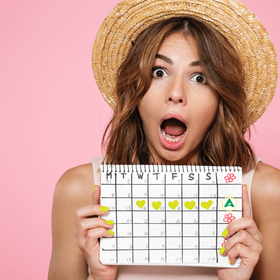 Woman shocked while holding up a calendar with the Atrantil logo on it.